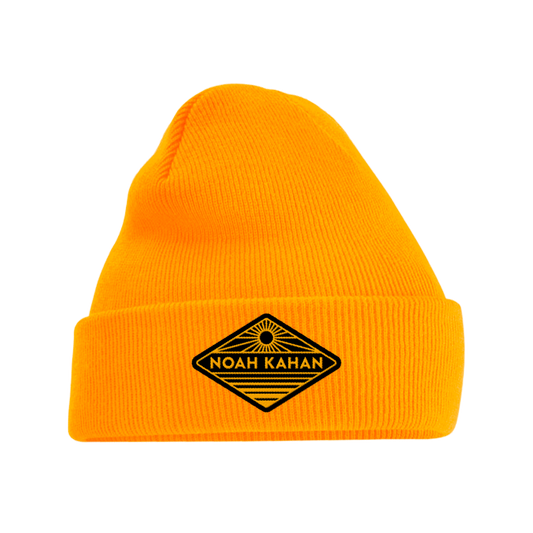 Noah Kahan yellow gold Sunrise Beanie with black and gold embroidered diamond shaped patch.